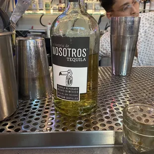 a bottle of liquor on a bar counter