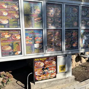 menus on the side of a building