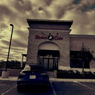 a car parked in front of the restaurant