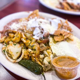 Green chilaquiles w/ potatoes &amp; over easy eggs