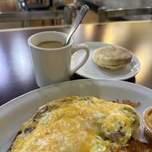 an omelet and a cup of coffee