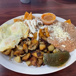 Red Chilaquiles, Easy Over Egg with House Potato's.