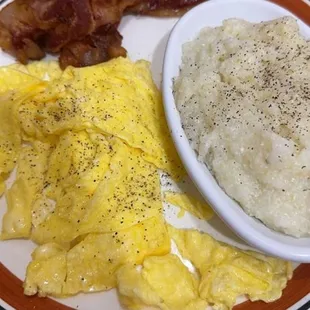 2 eggs, meat choice bacon, grits and biscuit