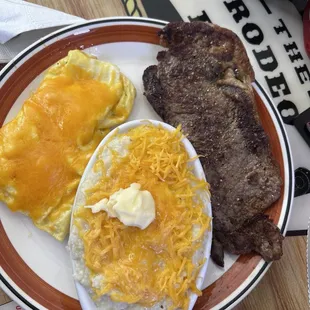 Scrambled cheese eggs, cheesy grits with steak