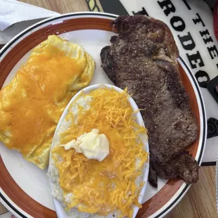 Scrambled cheese eggs, cheesy grits with steak