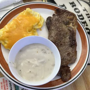 Gravy, cheese egg and tough medium steak