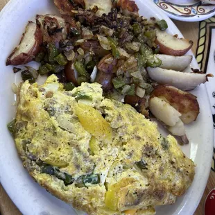 Home fries with peppers and onion. Banana peppers, sausage, cheese, onion omelette. Delicious