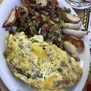 Home fries with peppers and onion. Banana peppers, sausage, cheese, onion omelette. Delicious