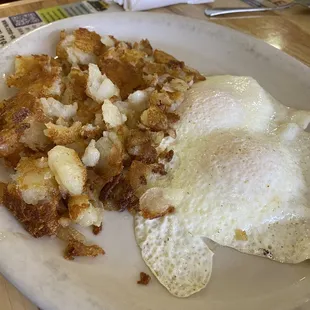Country Fried Steak comes with home fries and over-easy eggs!