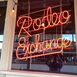 a neon sign in a window