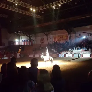 a man riding a horse at a show