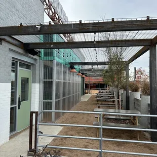 the outside of a building with a fenced in area