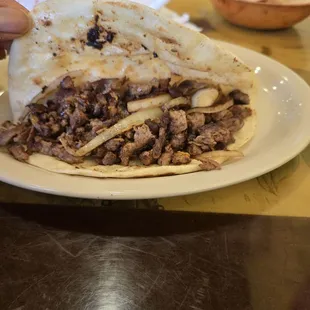 Inside of asada taco. Almost filled to the edge.