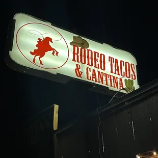 a neon sign for a restaurant