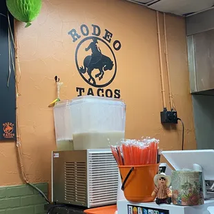 a bar with a pitcher of drink