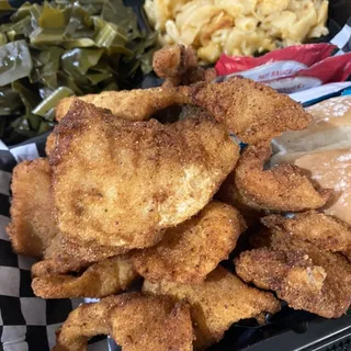 Cajun fried catfish sandwich with side