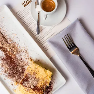 a plate of food and a cup of coffee