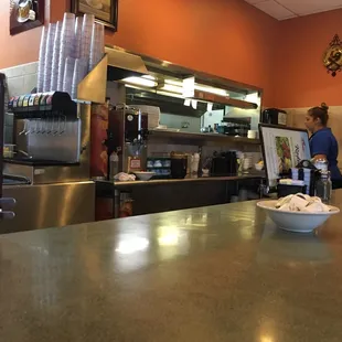 Waiting at the high top area for my takeout order... Very kind and helpful waitresses so far!