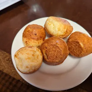 From Rodizio's website:  PÃO DE QUEIJO - Homemade Brazilian cheese bread made with traditional yucca flour and a blend of cheeses.