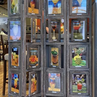 a room divider with pictures on it