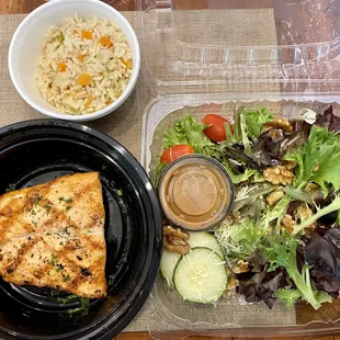 Salmon, rice pilaf, and salad