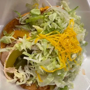 There&apos;s a chicken tostada under there somewhere.