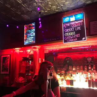 a woman sitting at a bar