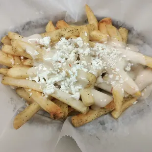 a close up of a plate of fries