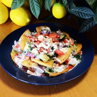 a plate of food with lemons in the background