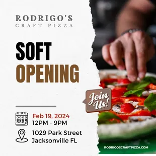 a person cutting a pizza