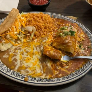 Enchilada, taco and rice and beans