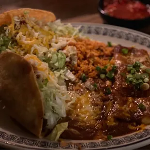 3 item Combination.  2 Shredded Beef. Tacos, Cheese Enchilada, Rice and Beans.