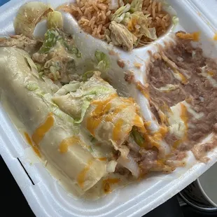 Shredded chicken enchiladas.