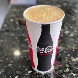 a drink in a paper cup