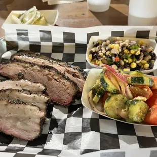 a tray of meat and vegetables