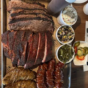 Brisket, Pork Ribs, Boudin, jalapeño cheddar Sausage, and sides.