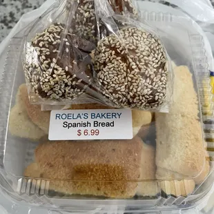 Oversized donut holes and Spanish bread.