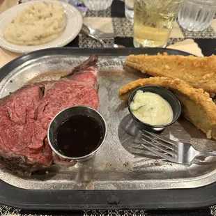 Prime rib with Parmesan encrusted walleye and garlic mashed potatoes.
