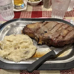 Cowboy (bone in) Ribeye with garlic mashed potatoes.