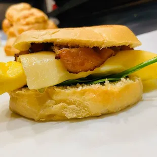 a bacon, cheese, and pineapple sandwich