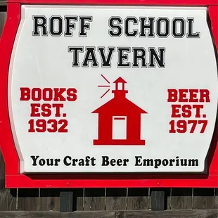 a sign for roff school tavern