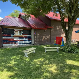a picnic table and bench in the yard
