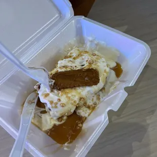 a piece of cake in a styrofoam container