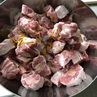 Oxtail, cut fresh in small pieces.