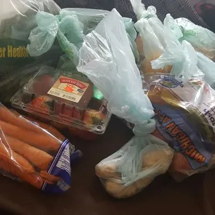 Bag of carrots, apples, 5 beets, 2 sweet potatoes, carton of strawberries, oranges, ginger root, kale and cilantro...guess the price...