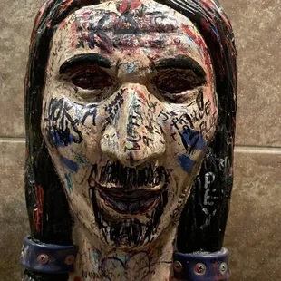 the face of a woman covered in graffiti