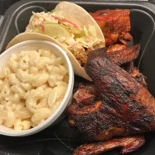 The sampler platter with pork ribs, wings, and pulled pork taco...