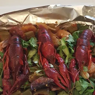 Seafood and sausage jambalaya.smoked cajun shrimp, crawfish and spicy sausage w/ chunky tomato, bell pepper and okra sauce served over rice