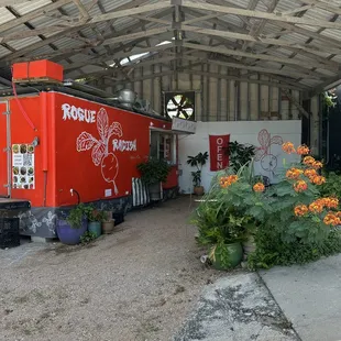a red truck parked in a garage
