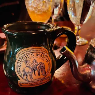 a teapot and a glass of water